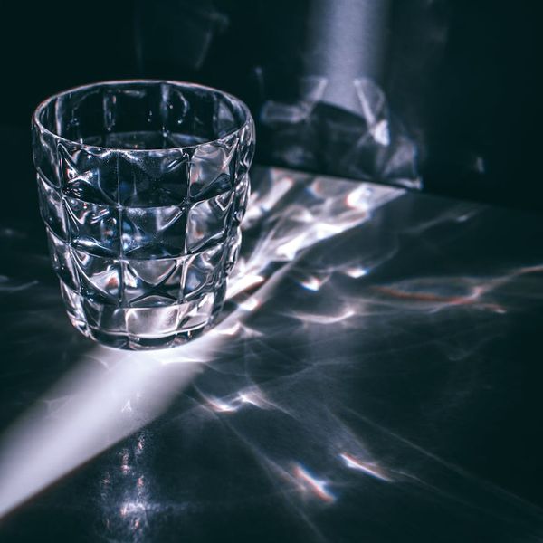 Macro shot of a glass prism catching light rays