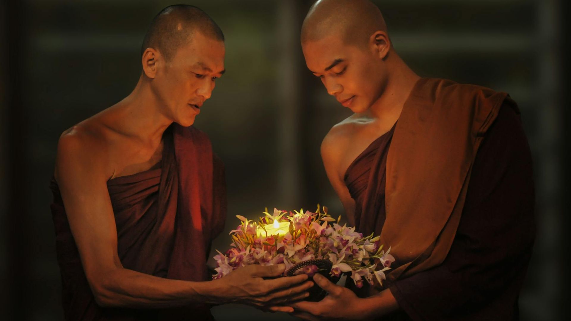 Person practicing mindfulness in a dark minimalist room with neon orchid glow