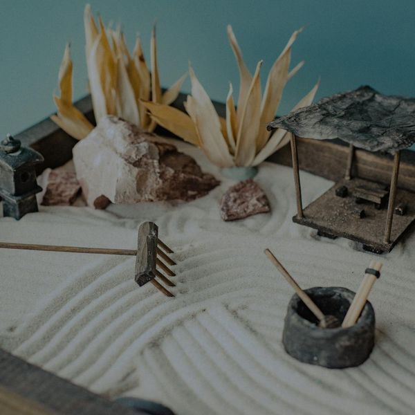 Zen garden elements in a minimalist dark setting